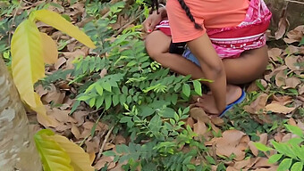 Young Girl Urinates Outdoors In The Woods