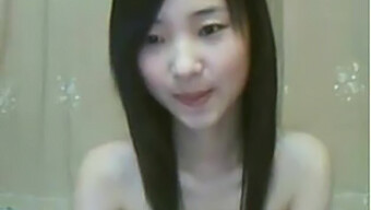 A Petite Asian Lass Indulges In Self-Pleasure Through Fingering On Webcam