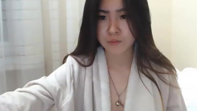 A Sultry Korean Lass Reaches Climax On Camera