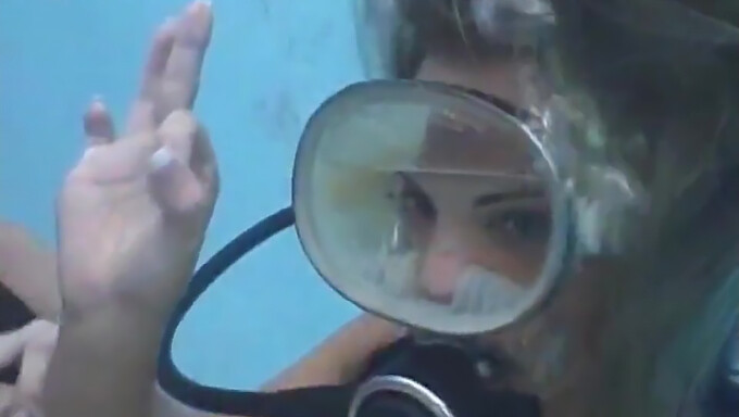 Scuba Diver Receives Facial From Partner Inside Her Mask