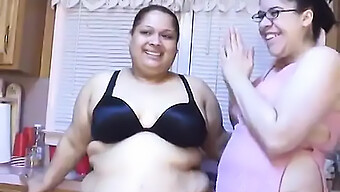 Two Plus-Sized Latinas Apply Lotion To Their Curves In The Kitchen